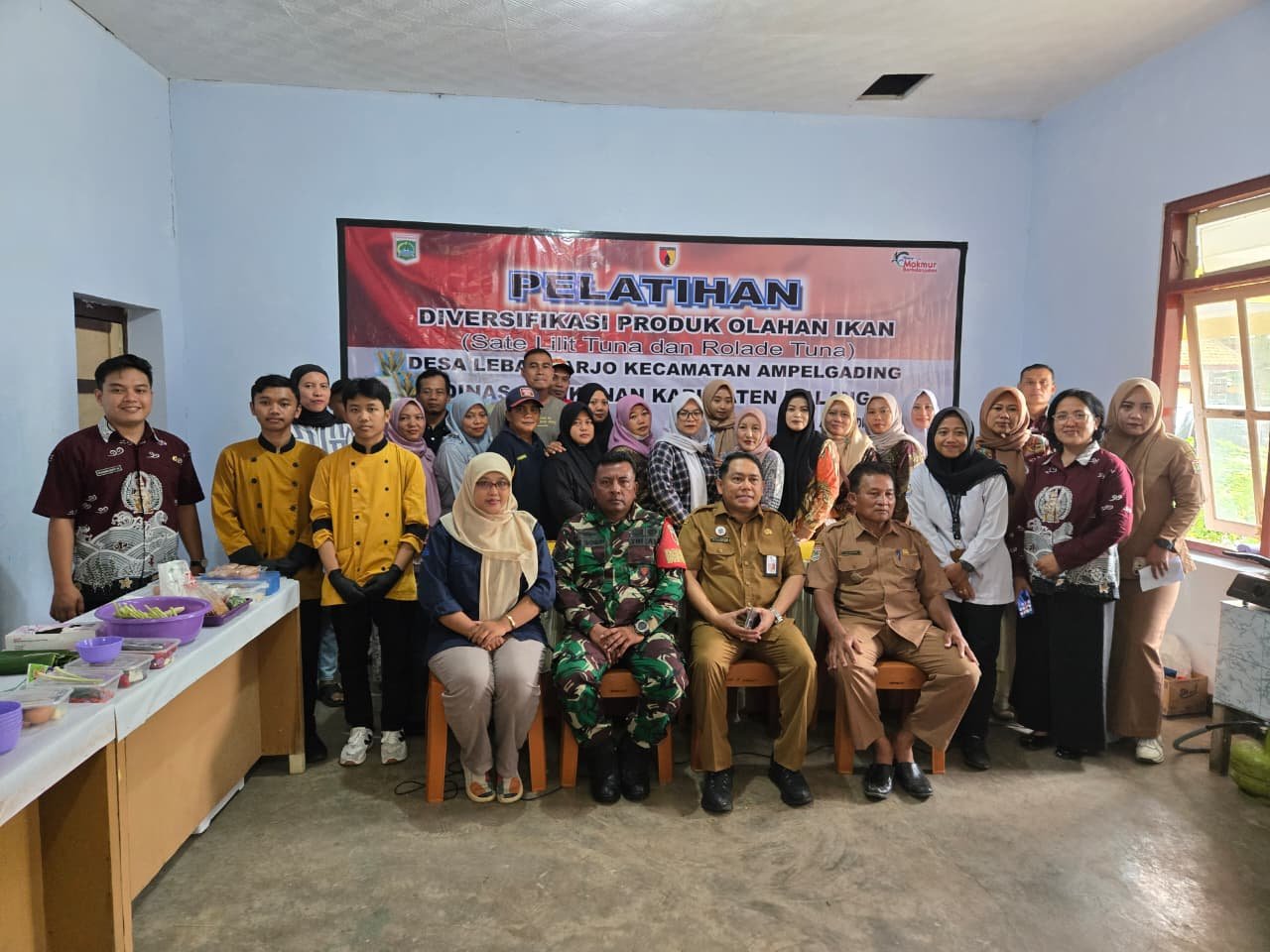 TNI Manunggal Membangun Desa (TMMD) Ke-126 Kodim 0818/Malang-Batu, Dinas Perikanan Kabupaten Malang turut berperan aktif melalui kegiatan Pelatihan Diversifikasi Produk Olahan Ikan yang dilaksanakan di Aula Desa Lebakharjo
